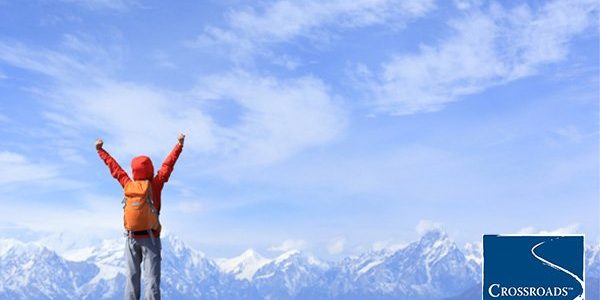 person Putting your recovery first standing on a mountaintop