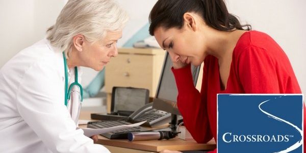 physical-toll-addiction-doctor-with-depressed-woman-patient-crblog2 doctor recognizing the physical toll of addiction in woman