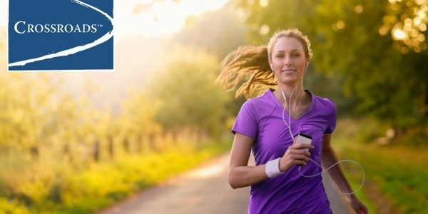 positive-mh-woman-listening-to-music-while-jogging-on-country-road-crblog1 woman staying positive in recovery by jogging outside and listening to music