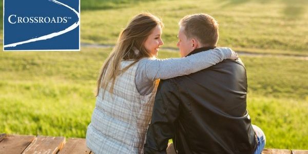 women-relationships-young-couple-sit-and-hug-together-outdoors-crblog2 woman sitting with man building a healthier relationship in recovery