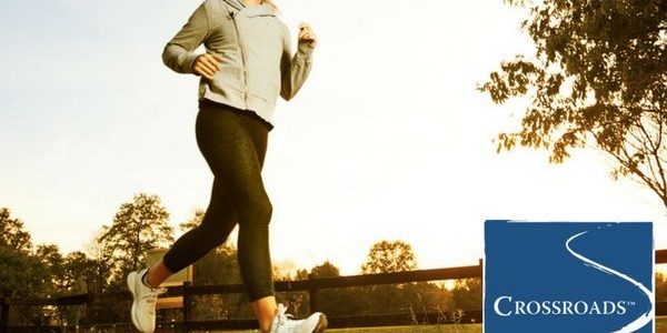 woman creating a heart-healthy lifestyle by running in the park