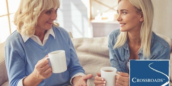 mother drinking coffee with daughter and creating healthy boundaries for their loved one struggling with addiction