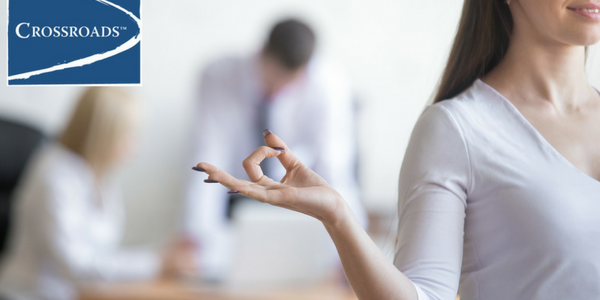 woman reducing stress without the need for drugs or alcohol at work