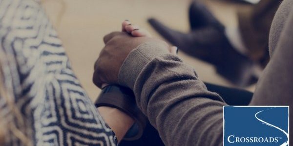 community volunteer support group holding hands