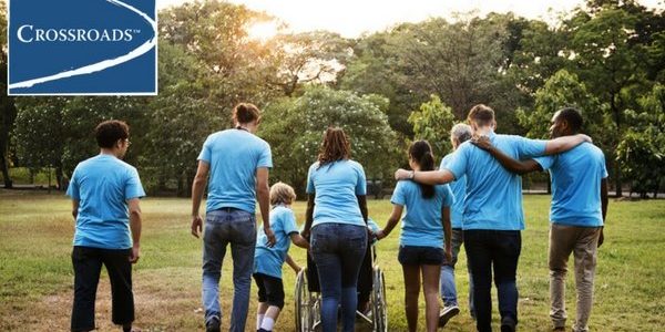 volunteer group walking together to support addiction recovery