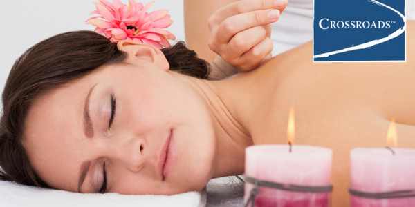 woman getting Acupuncture for Addiction Recovery at Crossroads