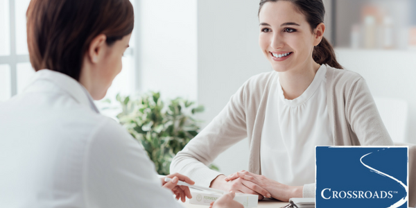 doctor telling woman what she needs to know about medication-assisted treatment for opioid addiction