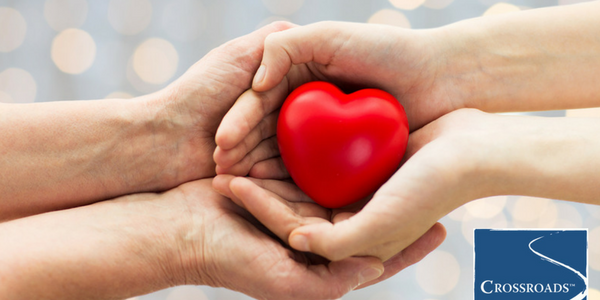 hands holding heart to show the impact of drugs and heart health
