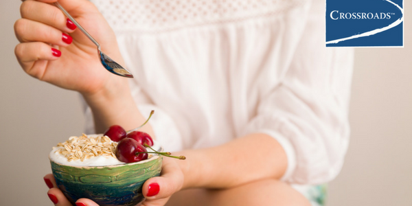 woman eating healthier diet for addiction recovery