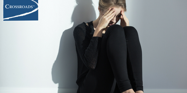 Has Your Drinking Become Problematic_.CRBlog1 woman sitting in a corner dealing with health problems from drinking alcohol