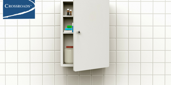 medicine cabinet ajar in bathroom