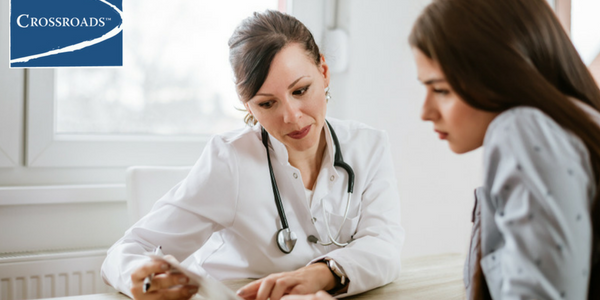doctor going over managing addiction and anxiety techniques together