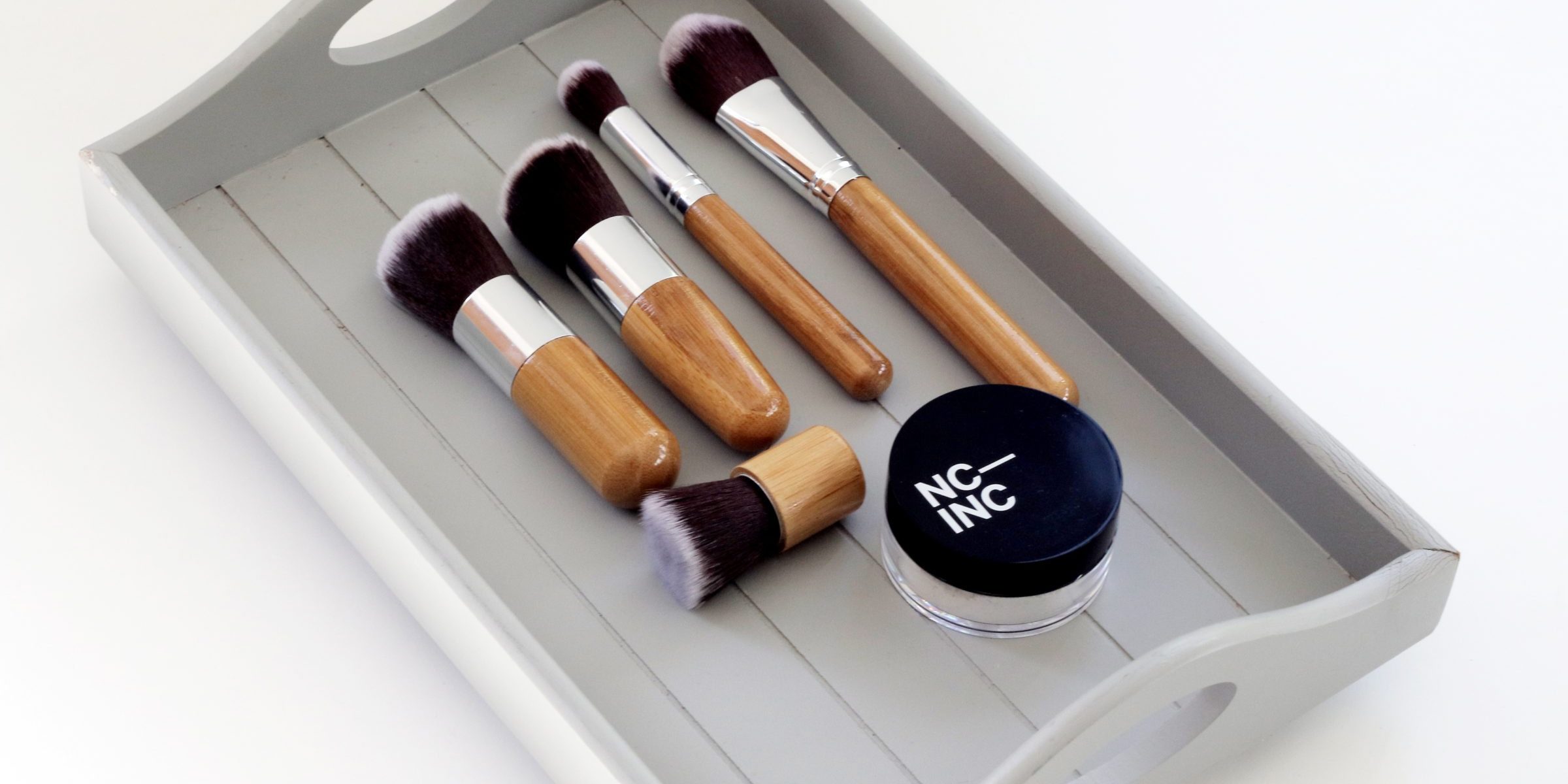 makeup in a wood tray