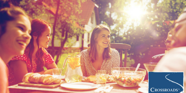 women sharing meal outside to socialize during their women's recovery program