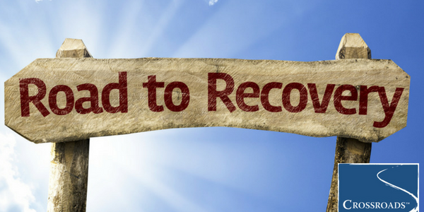 road to recovery sign for overcoming addiction