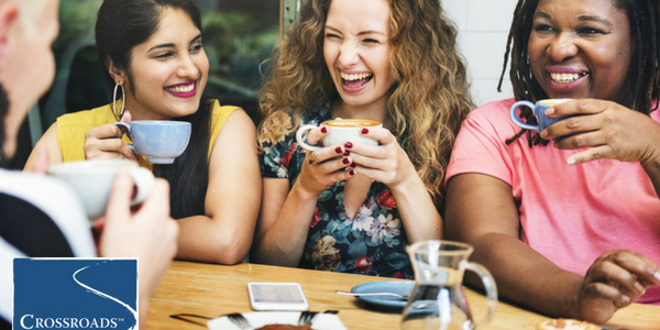 women sharing coffee and chatting to get through post-acute withdrawal syndrome