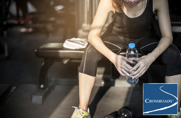 woman after playing sports in gym