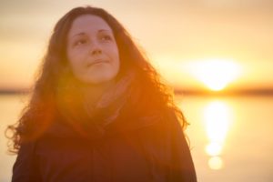 woman at sunset who is empowered from Crossroads' bipolar disorder treatment program