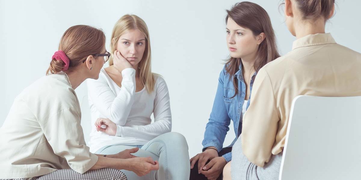 a group of women discuss the importance of women's addiction treatment