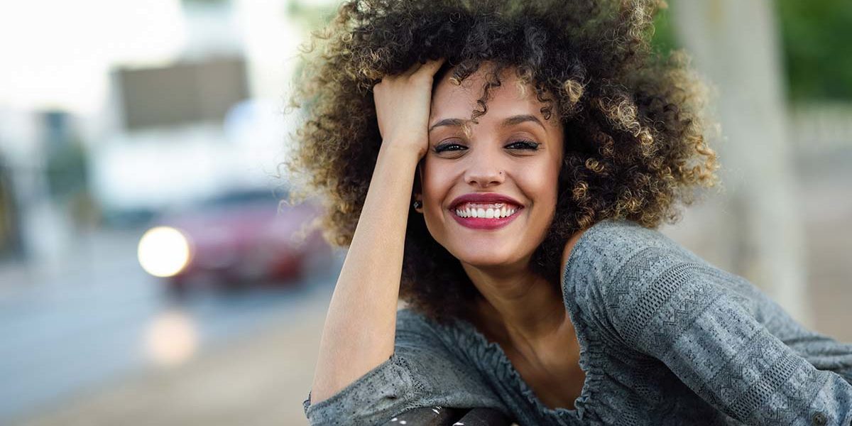 happy woman smiling celebrating national recovery month