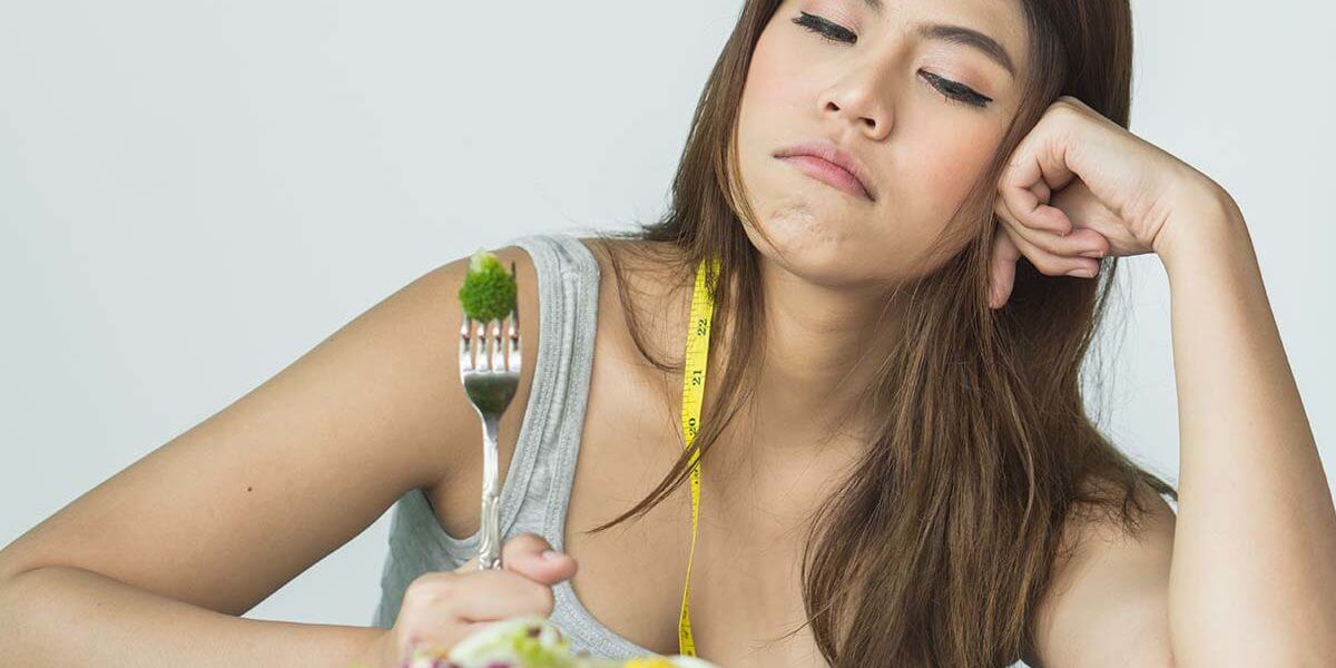 Young Woman Experiencing An Eating Disorder