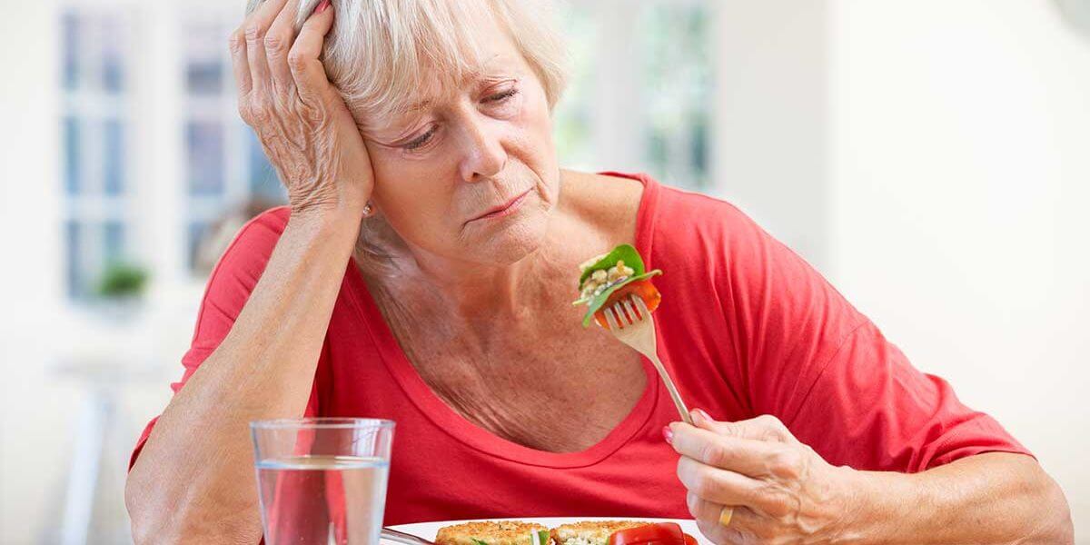 a woman struggles with eating disorder relapse signs