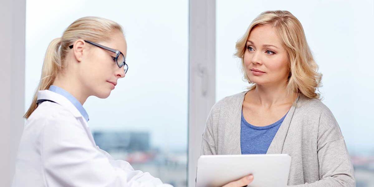 a woman enrolls in an alcohol addiction treatment center