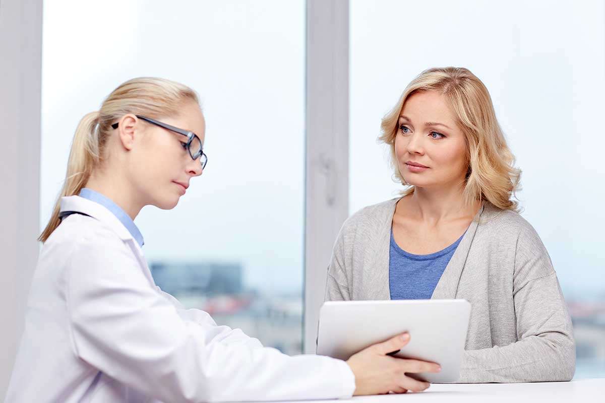 a woman enrolls in an alcohol addiction treatment center