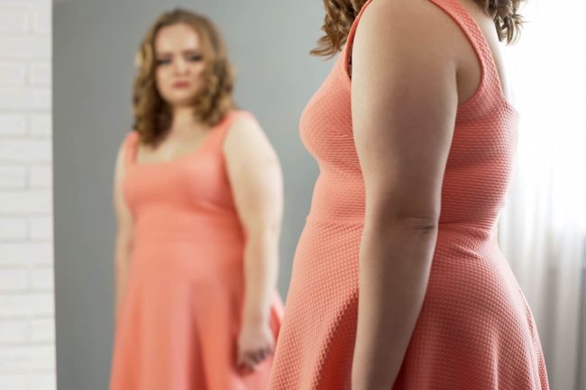 10 Facts About Eating Disorders Recognize NEDA Week 2022 a woman wants to learn facts about eating disorders