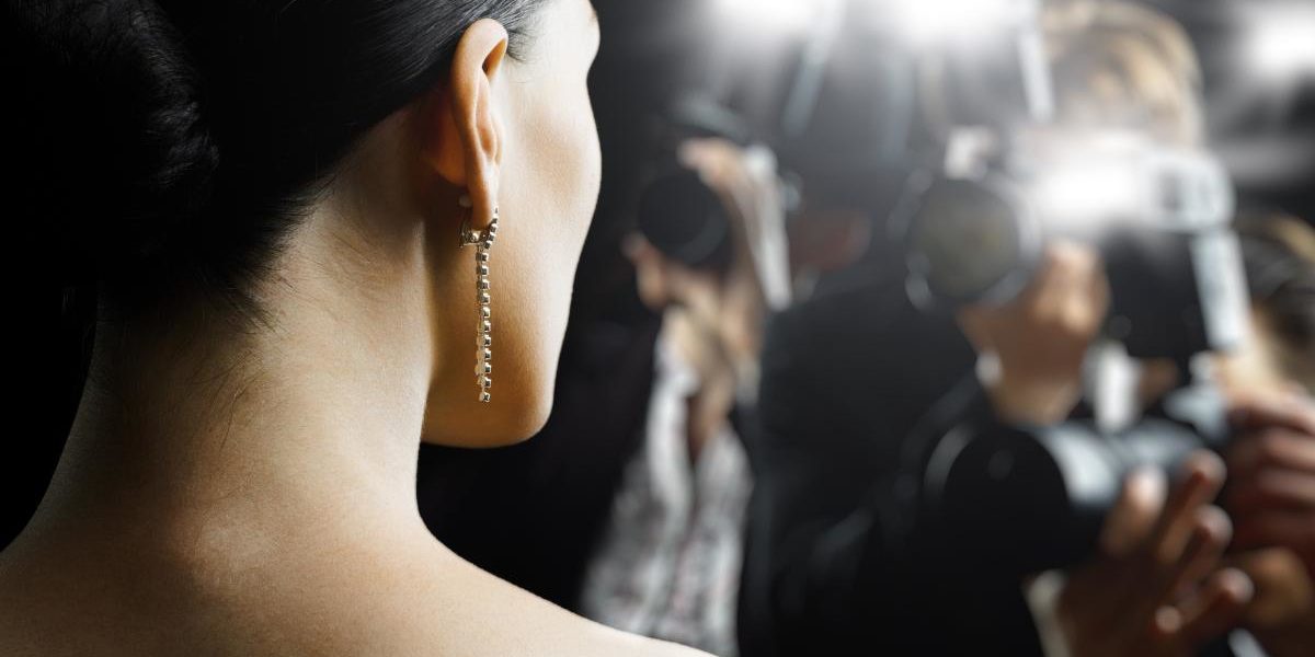 3 Celebrities Who Got Help For Addiction an actress in flashing camera lights considers a celebrity with drug addiction and celebrity rehab