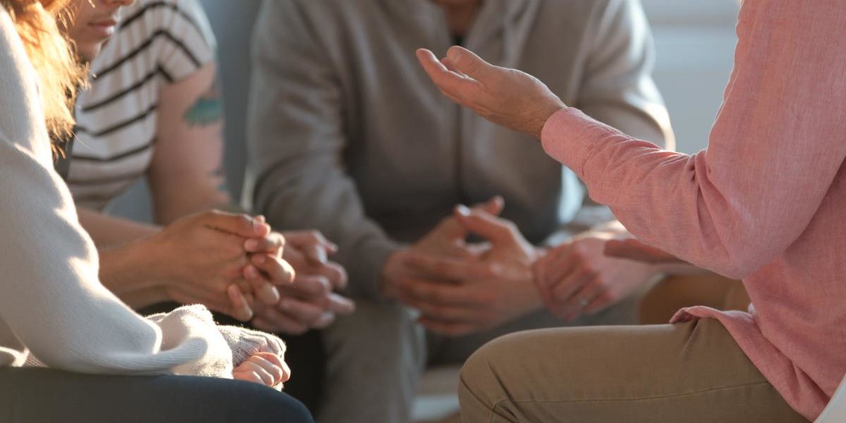 people in a group discussing the benefits of iop