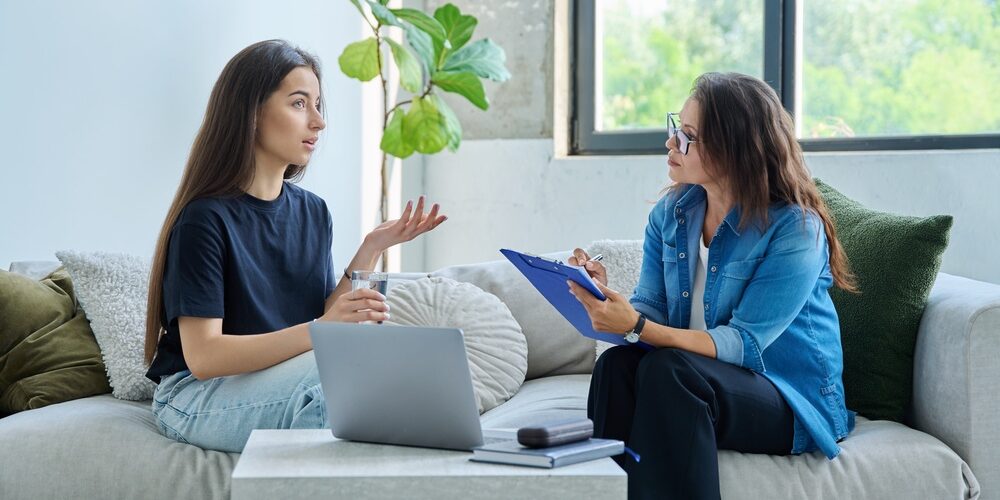 Teenage,Girl,Patient,In,Therapy,Session,With,Social,Mental,Therapist